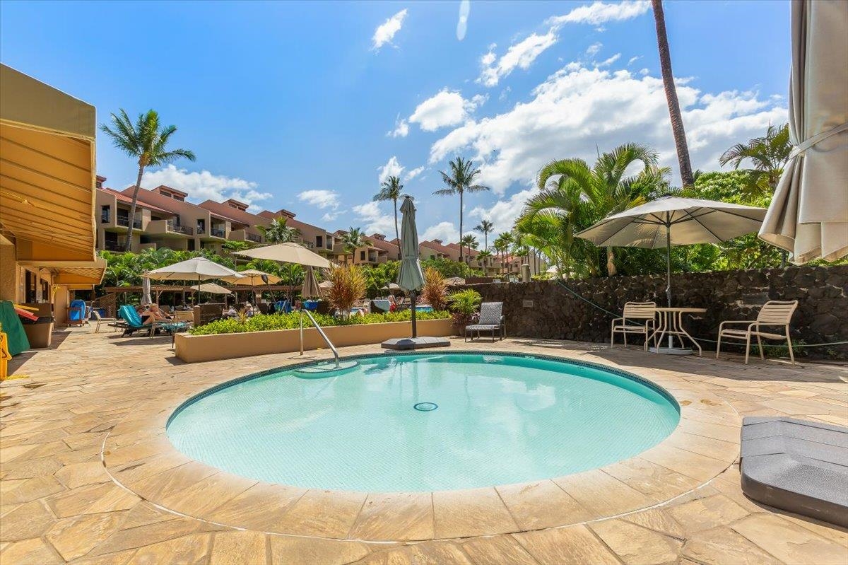 2695 South Kihei Road, Unit 5114 Kihei, HI 96753 - Photo 30 of 47 a swimming pool with outdoor seating yard and barbeque oven