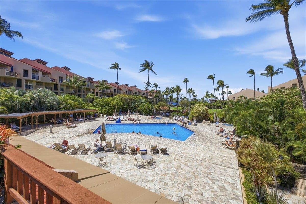 2695 South Kihei Road, Unit 5114 Kihei, HI 96753 - Photo 32 of 47 a view of a swimming pool with a table and chairs
