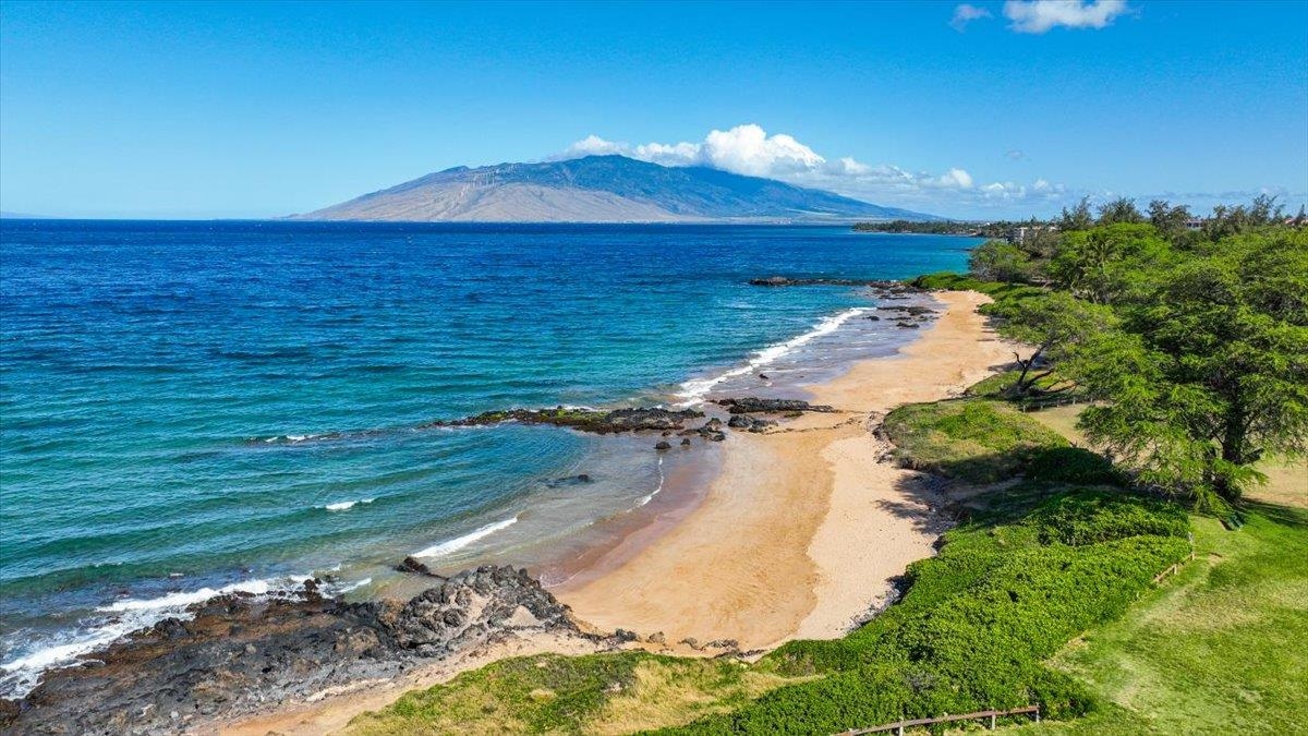 2695 South Kihei Road, Unit 5114 Kihei, HI 96753 - Photo 39 of 47 a view of a lake with a yard