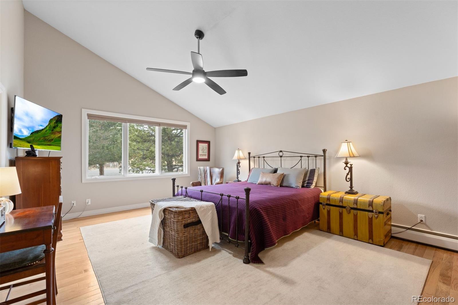 32430 Inverness Drive Evergreen, CO 80439 - Photo 18 of 50 a bedroom with bed and window