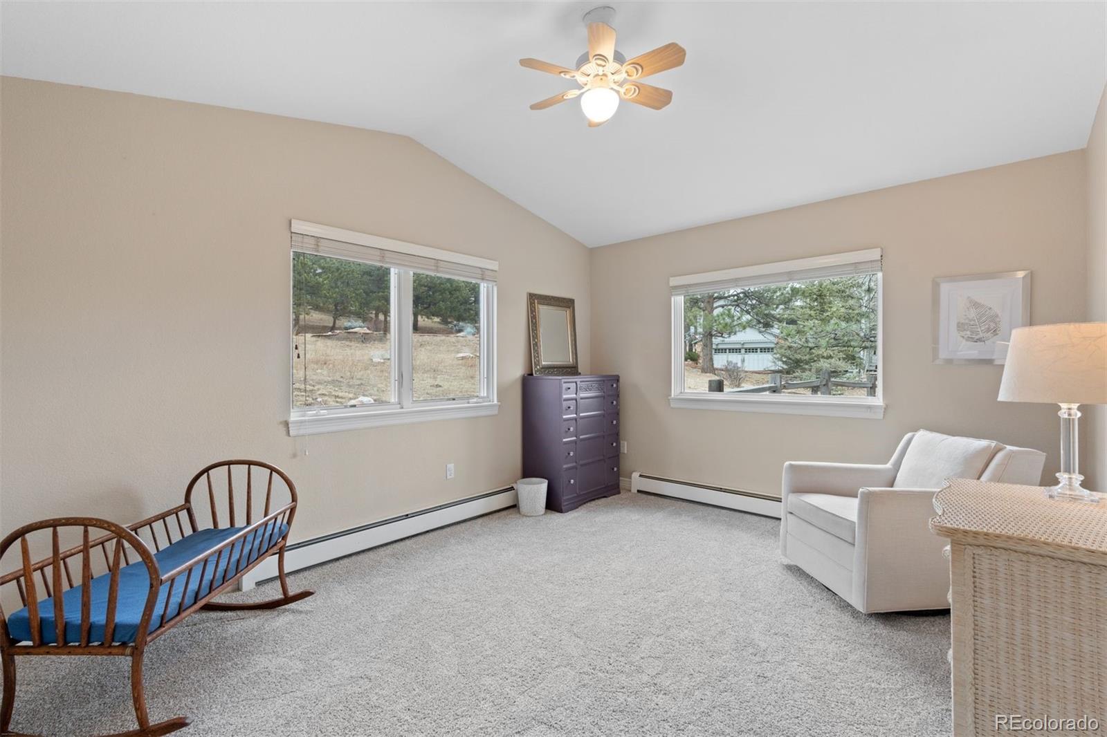 32430 Inverness Drive Evergreen, CO 80439 - Photo 27 of 50 a living room with furniture and a window
