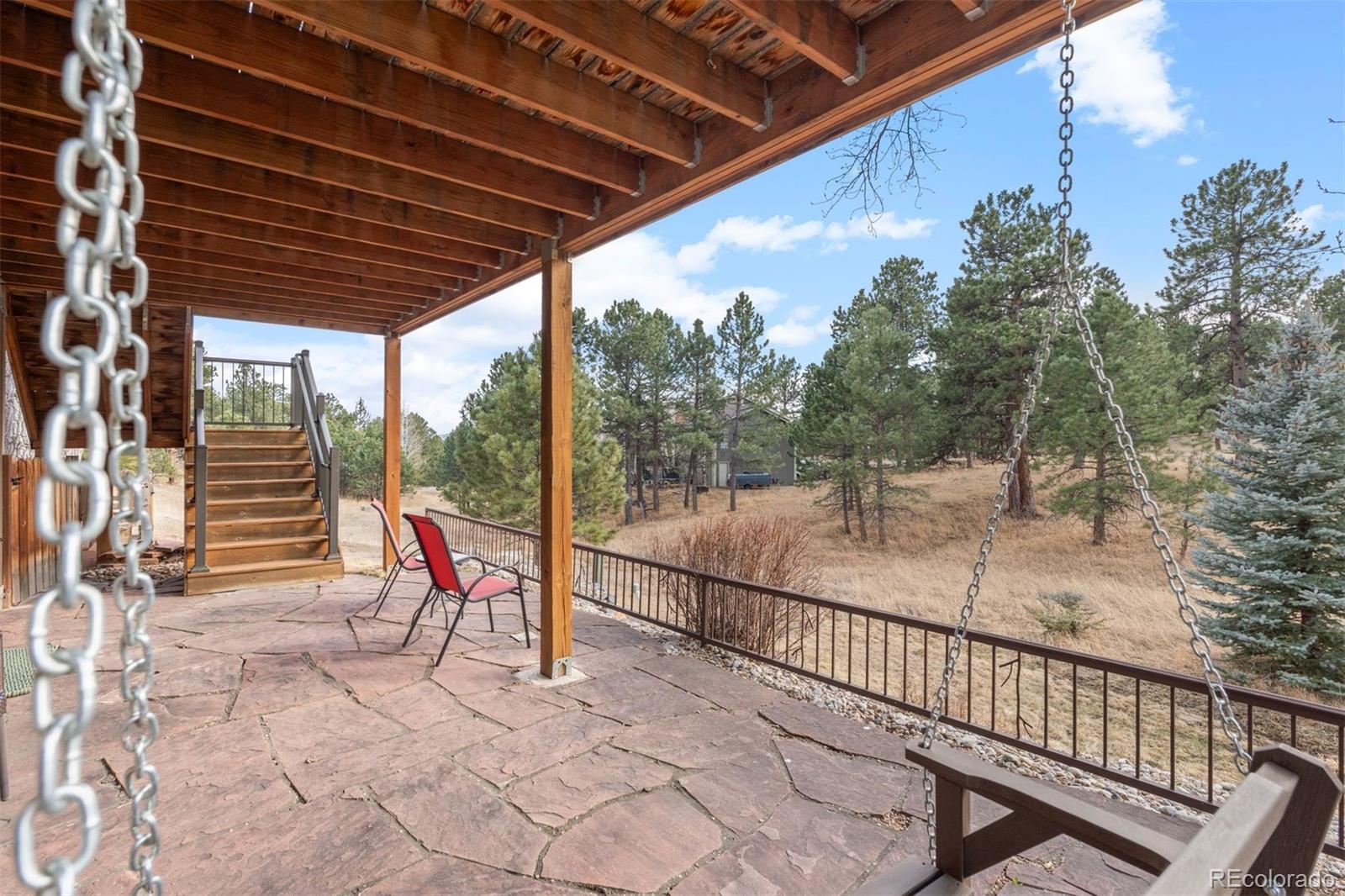 32430 Inverness Drive Evergreen, CO 80439 - Photo 36 of 50 a view of a two chairs in the balcony