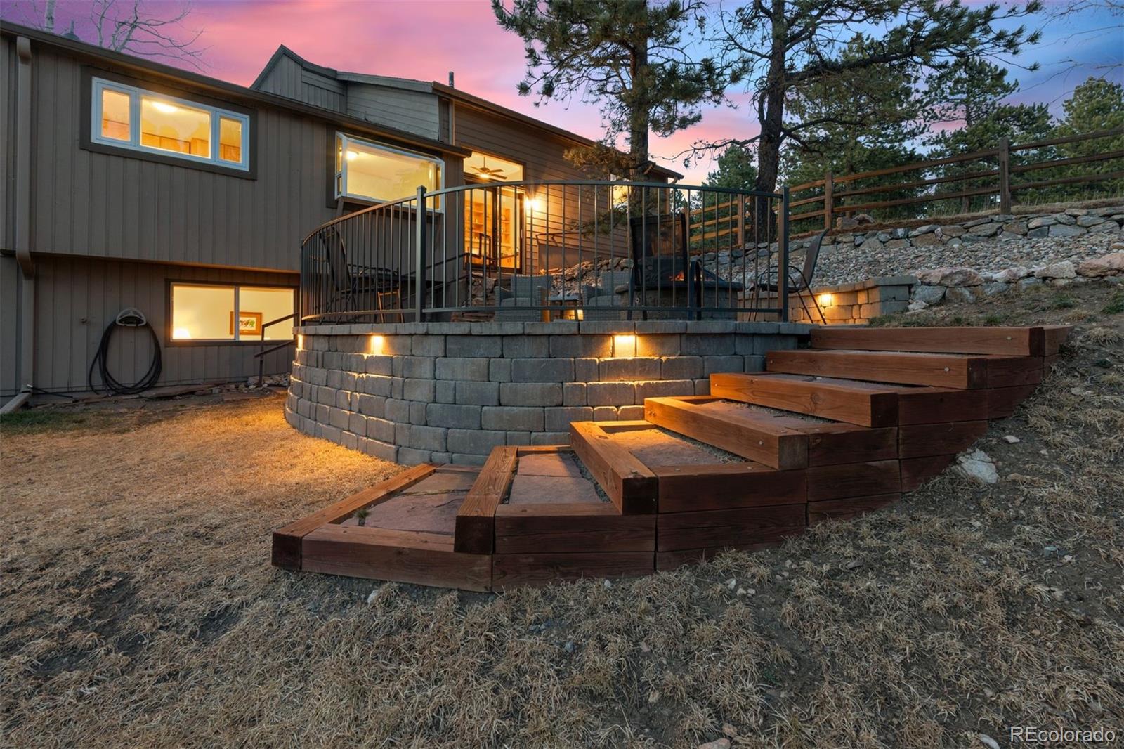 32430 Inverness Drive Evergreen, CO 80439 - Photo 42 of 50 a view of a house with backyard and sitting area