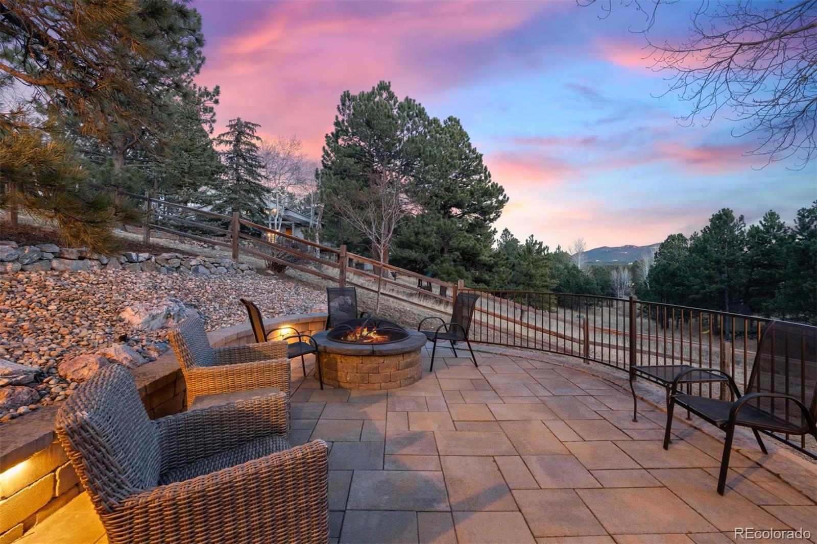 32430 Inverness Drive Evergreen, CO 80439 - Photo 44 of 50 a view of a roof deck with couches and sky view