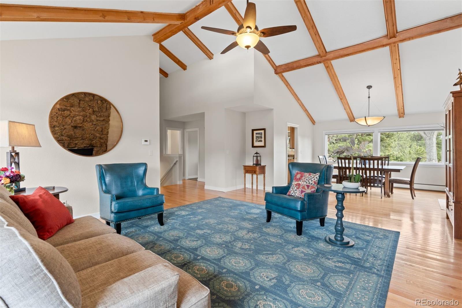 32430 Inverness Drive Evergreen, CO 80439 - Photo 5 of 50 a living room with furniture and a large window