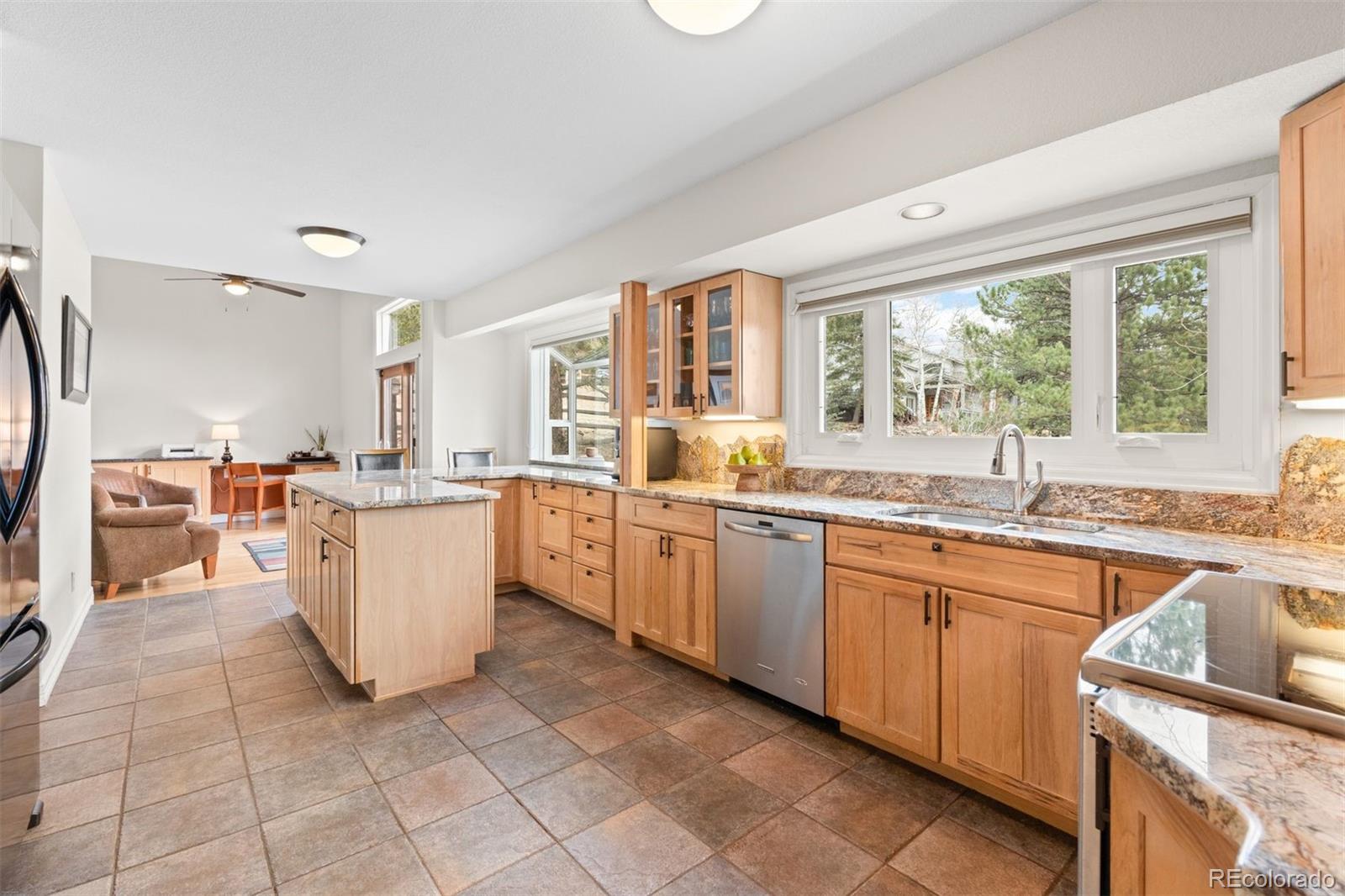 32430 Inverness Drive Evergreen, CO 80439 - Photo 7 of 50 a kitchen with a sink and cabinets
