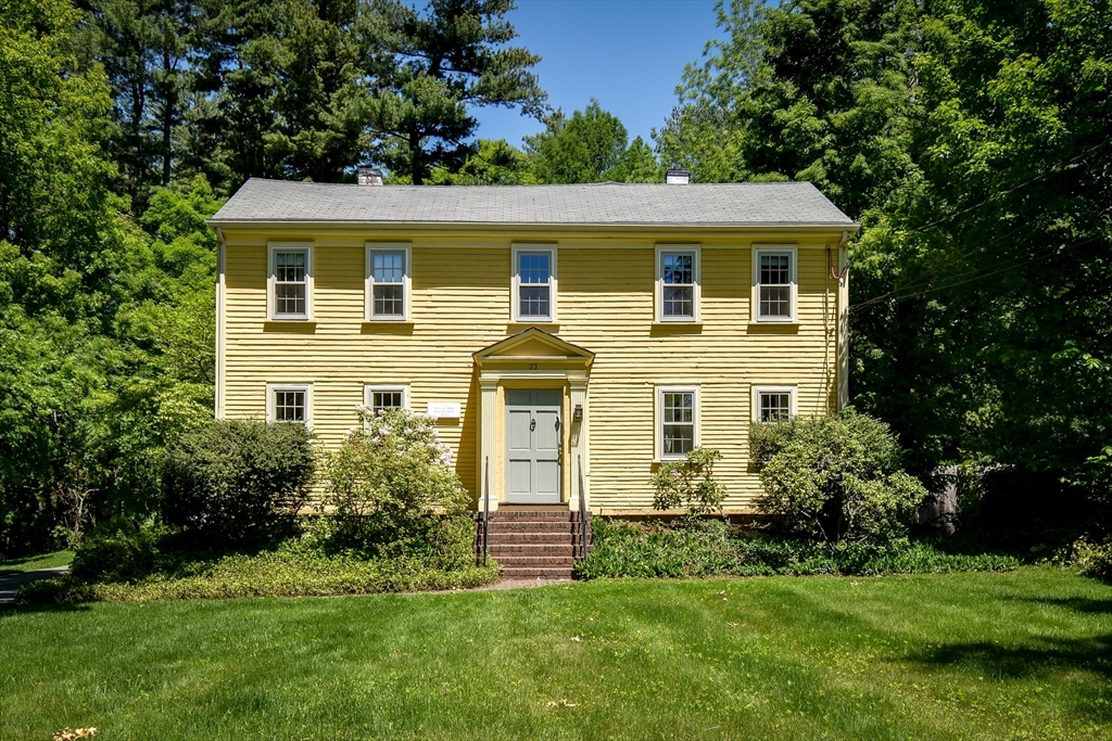 33 Grove Street Framingham, MA 01701 - Photo 1 of 33 a front view of a house with a garden