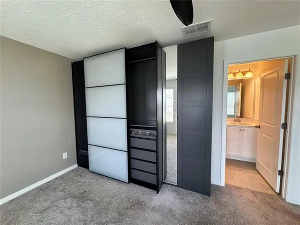 a view of a hallway with entryway door