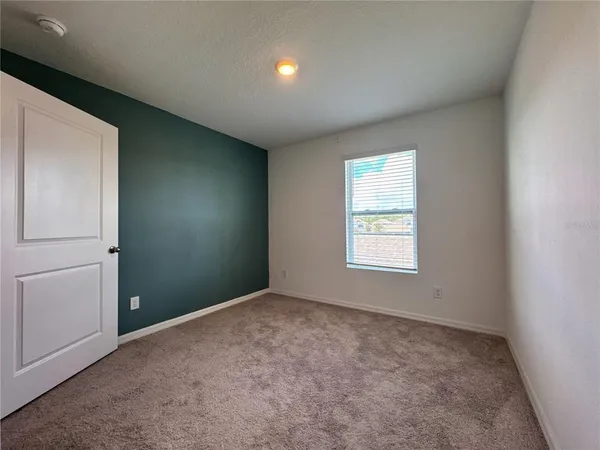 a bathroom with a sink vanity and a mirror