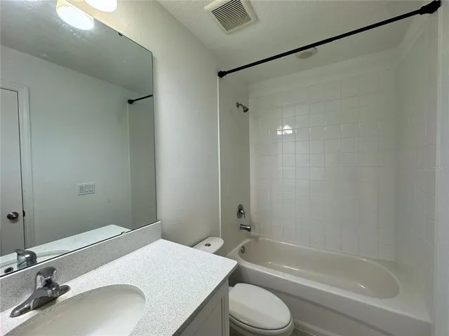 an empty room with a window and painted walls