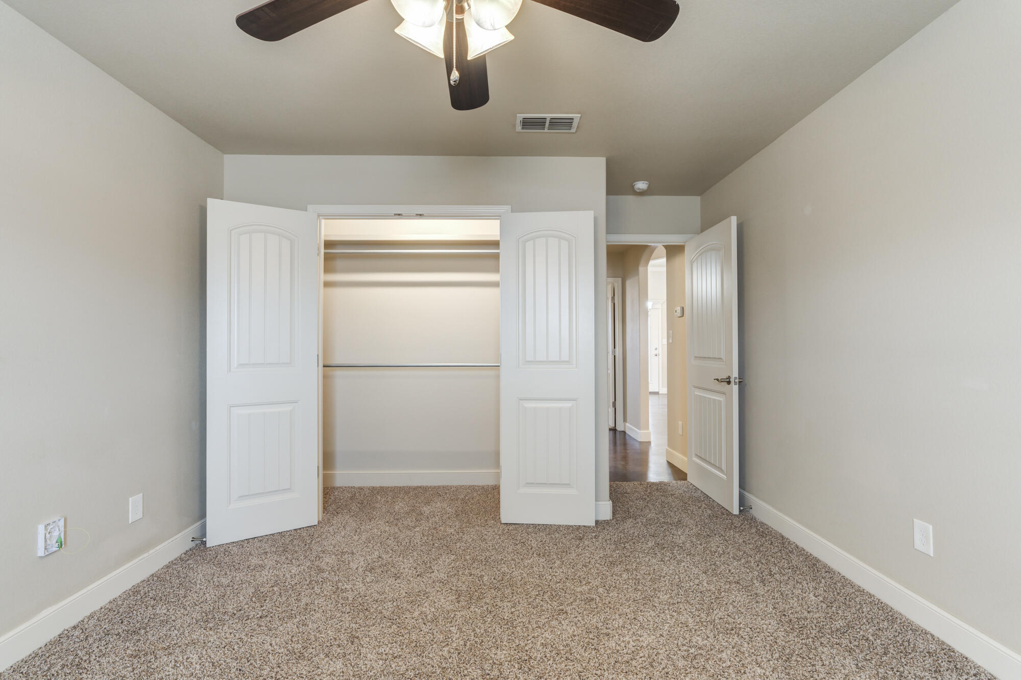 5220 Marshall Street Lubbock, TX 79416 - Photo 12 of 14 a view of an empty room and chandelier fan