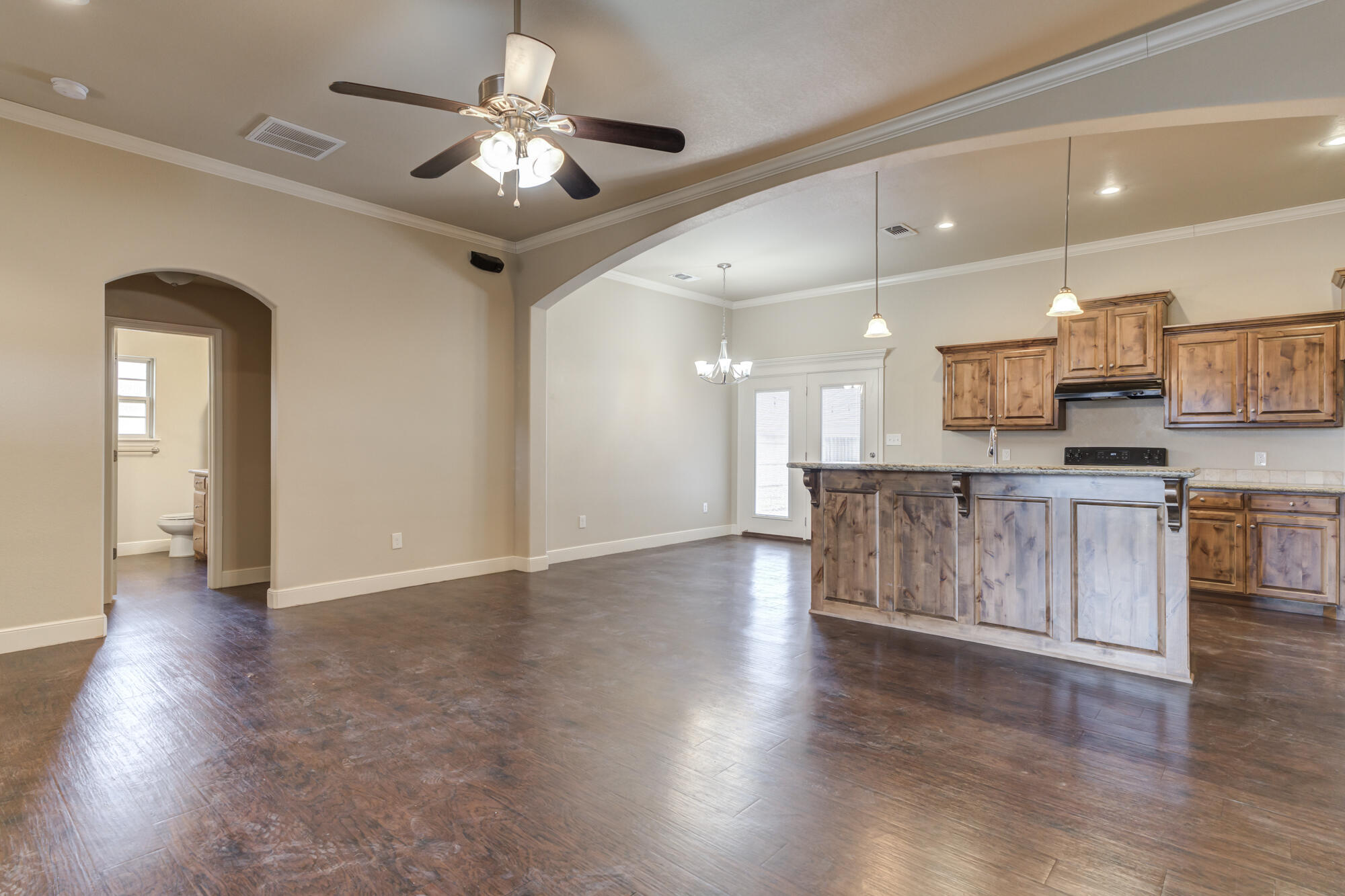 5220 Marshall Street Lubbock, TX 79416 - Photo 2 of 14 a view of a kitchen with a sink and a chandelier