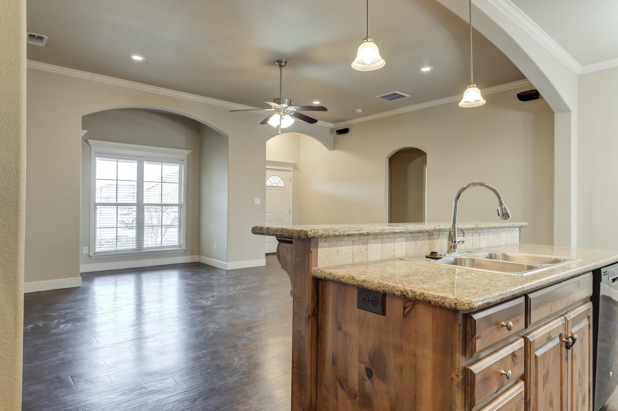 5220 Marshall Street Lubbock, TX 79416 - Photo 4 of 14 a kitchen with a sink a counter space and a dining table