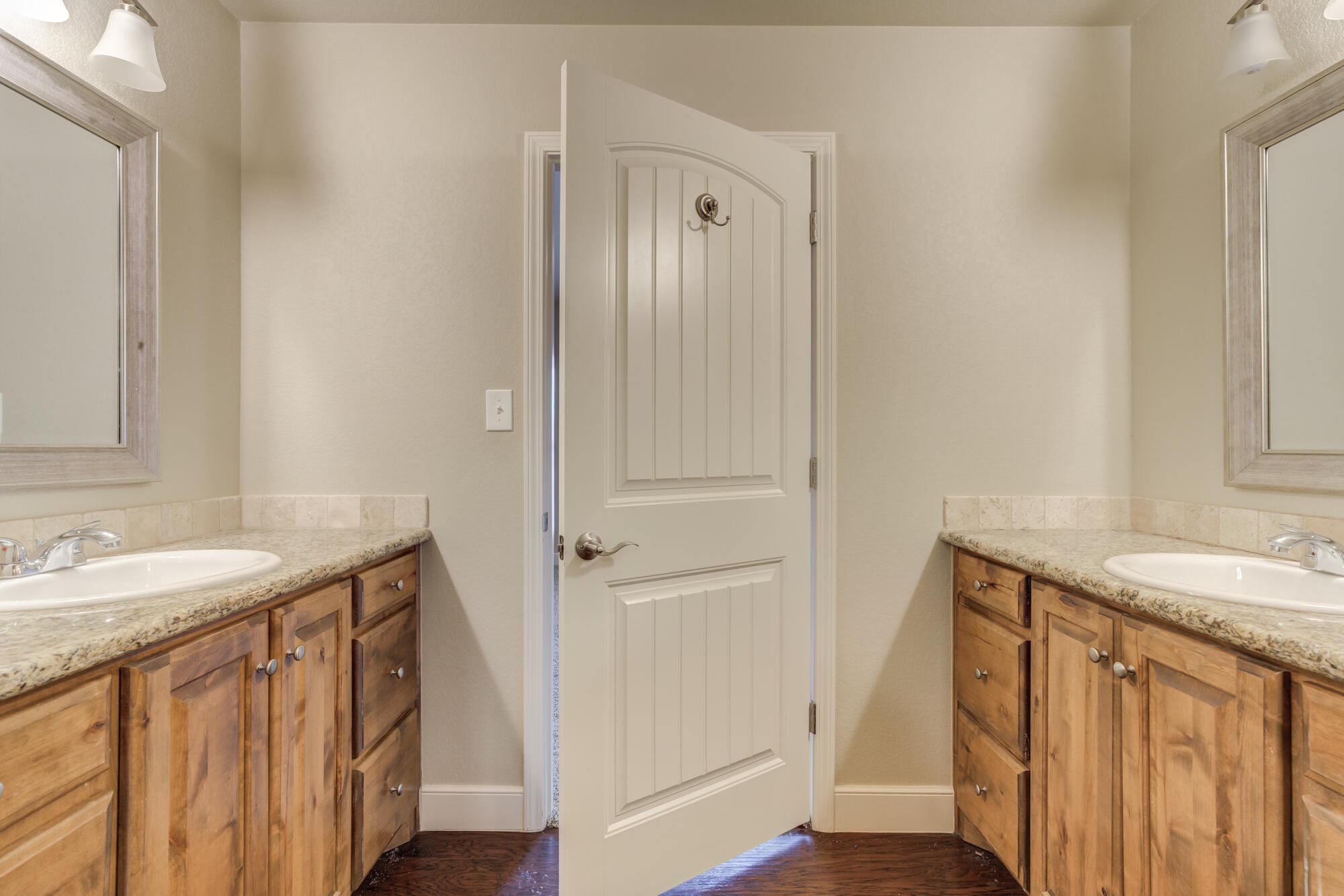 5220 Marshall Street Lubbock, TX 79416 - Photo 7 of 14 a bathroom with a sink a mirror and a shower