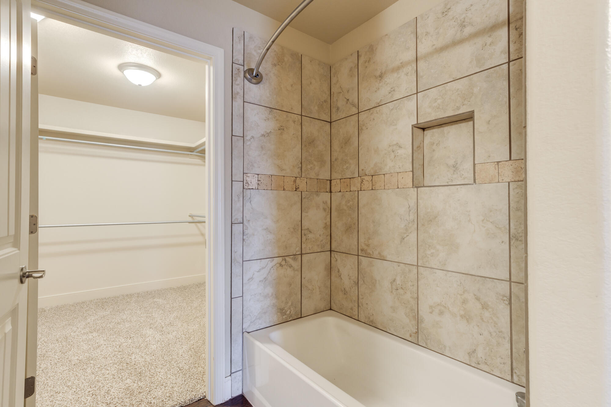 5220 Marshall Street Lubbock, TX 79416 - Photo 8 of 14 a bathroom with a bath tub