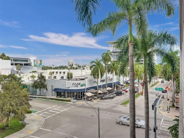 a view of a building with a palm tree