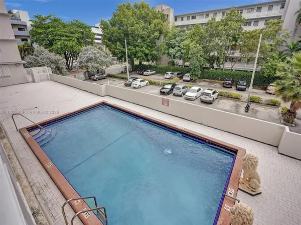 a view of swimming pool from a balcony