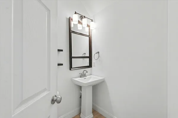 a bathroom with a sink a mirror and a bathtub