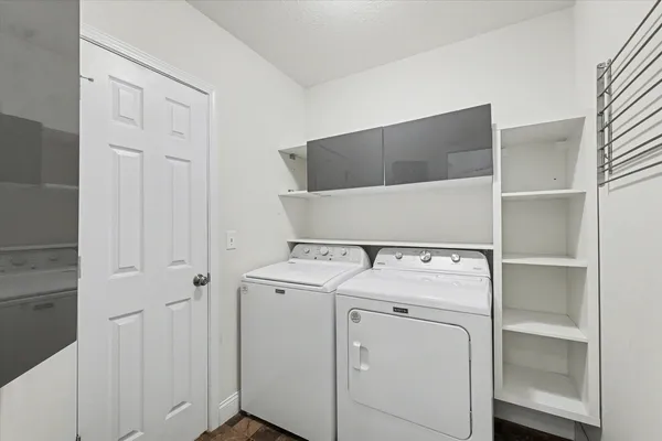 a utility room with dryer and washer