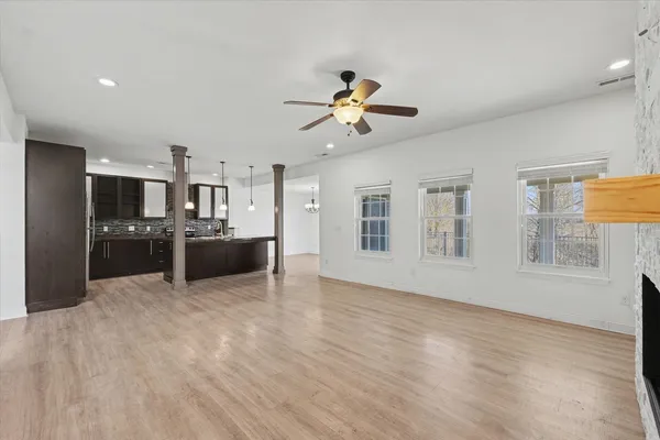 a view of a kitchen with a sink hardwood floor and a kitchen