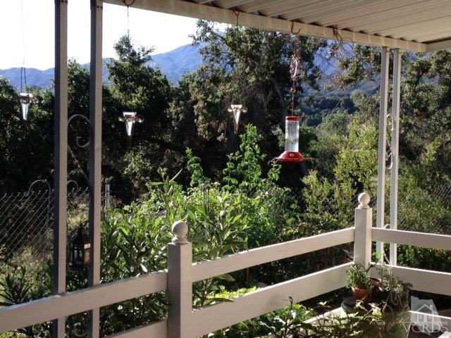 1225 South Rice Road, Unit 49 Ojai, CA 93023 - Photo 2 of 20 a view of a tree in front of a house