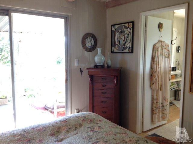 1225 South Rice Road, Unit 49 Ojai, CA 93023 - Photo 18 of 20 a bedroom with a bed and a window