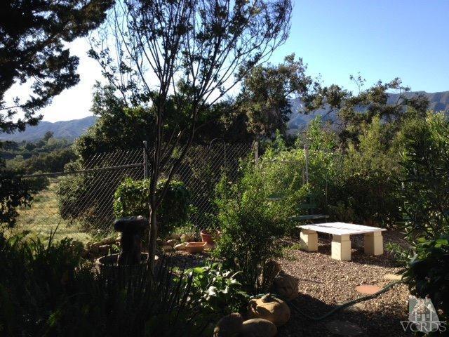1225 South Rice Road, Unit 49 Ojai, CA 93023 - Photo 4 of 20 a view of a house with a yard