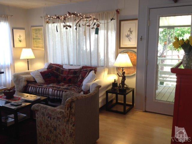1225 South Rice Road, Unit 49 Ojai, CA 93023 - Photo 8 of 20 a living room with furniture and a chandelier