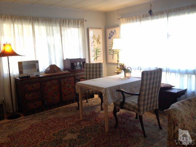 1225 South Rice Road, Unit 49 Ojai, CA 93023 - Photo 10 of 20 a view of a dining room with furniture window and outside view