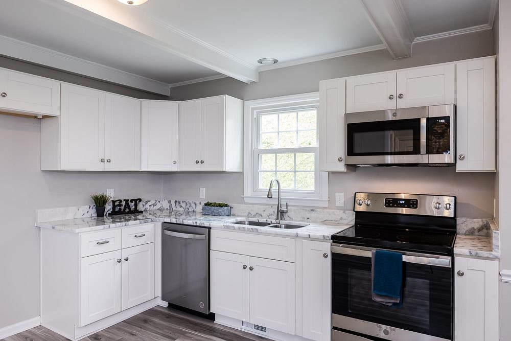 744 South Hollybrook Road Wendell, NC 27591 - Photo 9 of 30 Prepare to be wowed! This new kitchen boasts new cabinets, granite countertops, new sink and appliances. Kitchen