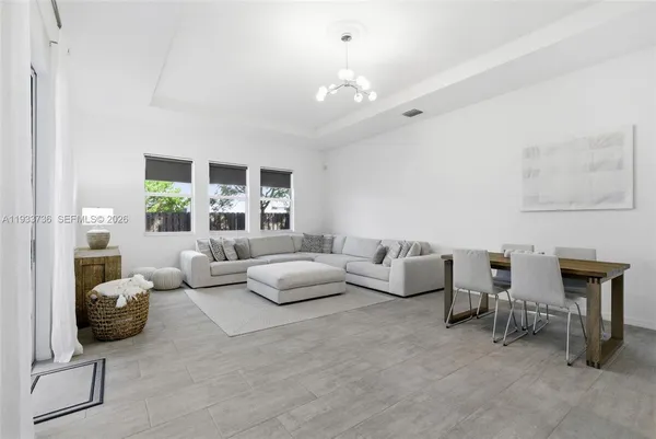 a living room with furniture and a window