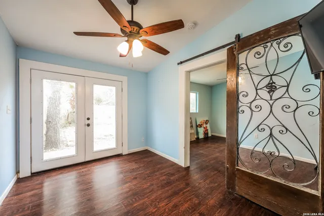 a view of an entryway with wooden floor