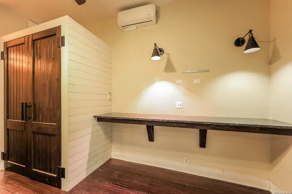 a bathroom with a sink and mirror