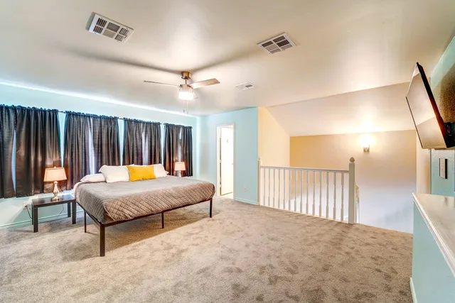 a bed room with a bed and a couch