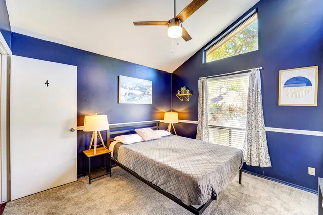 a bed room with a bed and a window