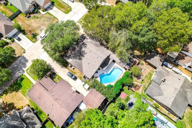 an aerial view of a house with a garden
