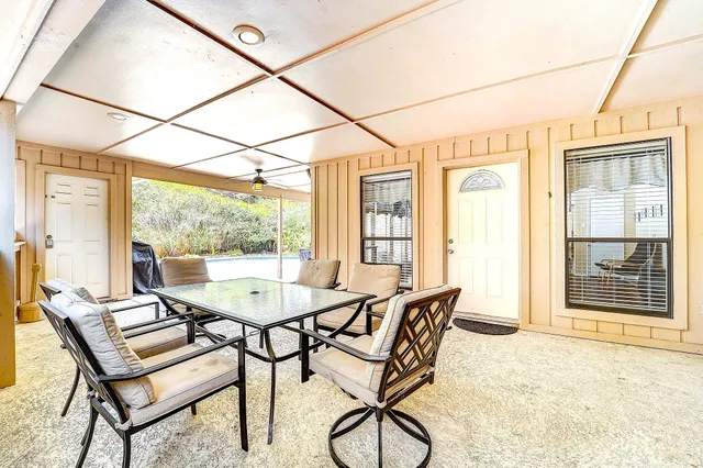 a dining room with furniture and window