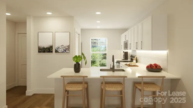 a living room with furniture a clock on wall and a window
