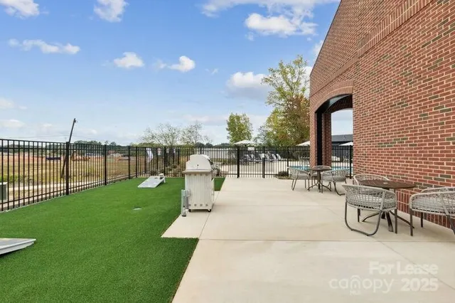 a view of swimming pool with outdoor seating