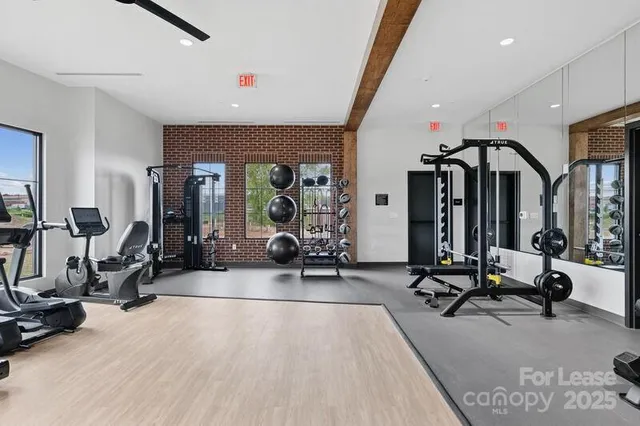 a view of a dining room with furniture and window