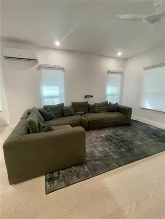 a living room with furniture and a couch