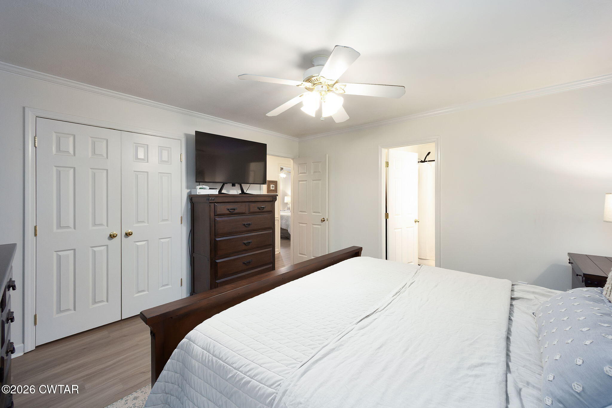 80 Rooker Drive Jackson, TN 38305 - Photo 15 of 30 a bedroom with a bed and a flat screen tv