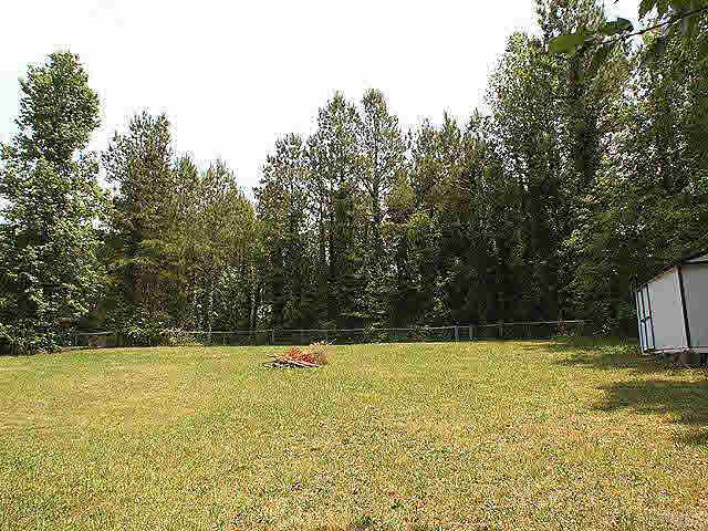 2809 Girth Lane Raleigh, NC 27603 - Photo 8 of 10 a view of a swimming pool and trees in the background