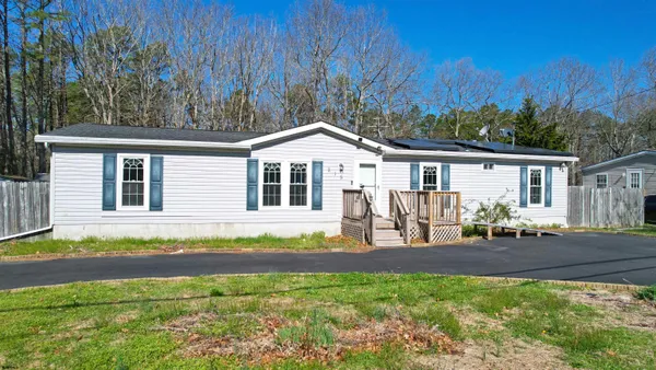 a front view of a house with a patio