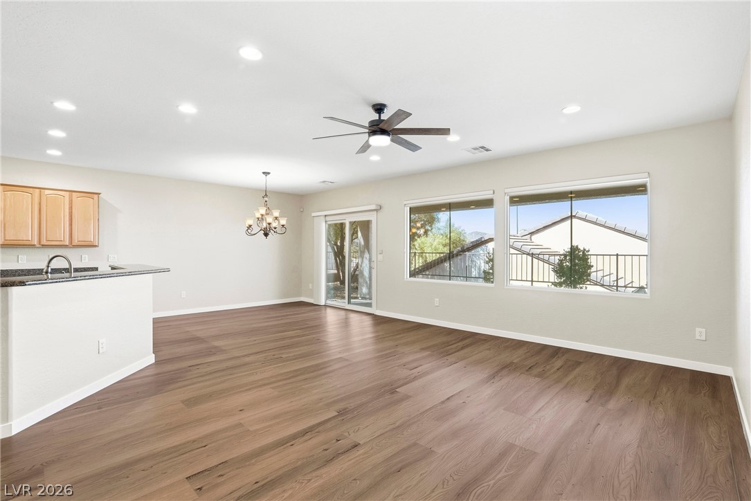 2541 Darda Street Henderson, NV 89044 - Photo 8 of 26 This bright interior space features wood flooring, recessed lighting, and large windows.