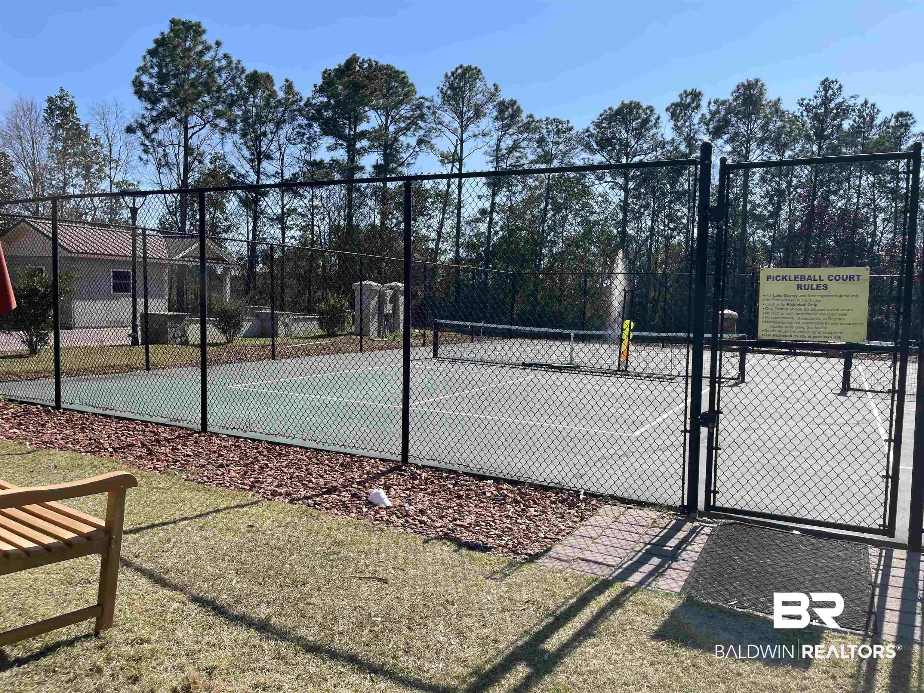 27441 Highway 98 Elberta, AL 36530 - Photo 18 of 20 View of tennis court with a gate and fence
