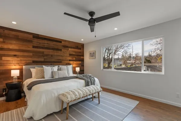 a bedroom with a large bed and a window