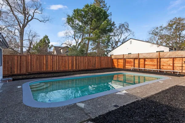a view of a backyard with a tub