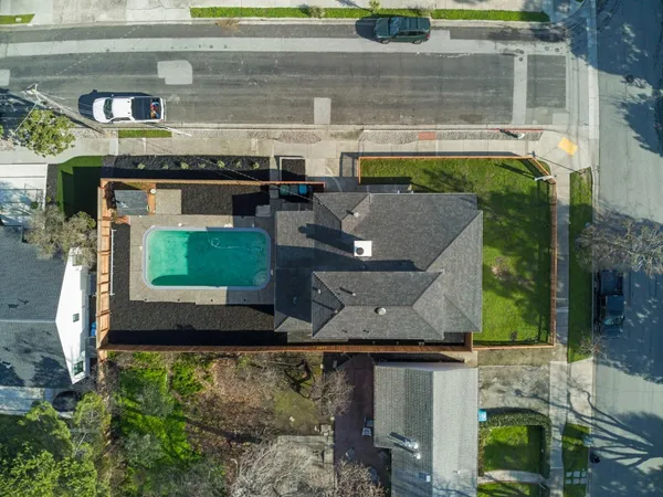 an aerial view of a residential apartment building with a yard