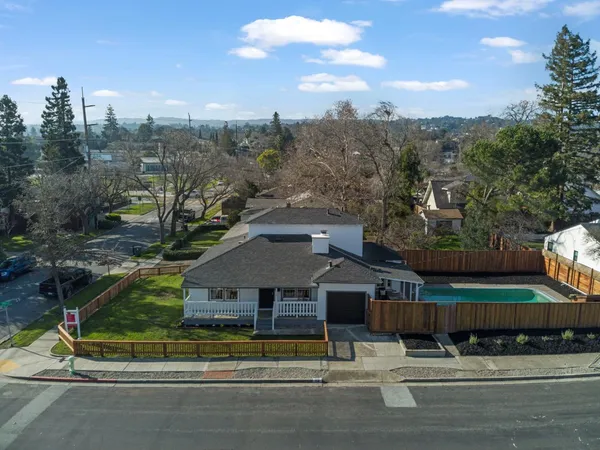 a view of a house with a yard from a terrace
